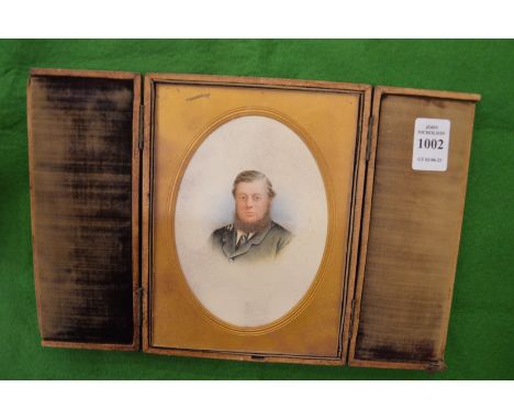A leather cased miniature portrait bust of a bearded gentleman.