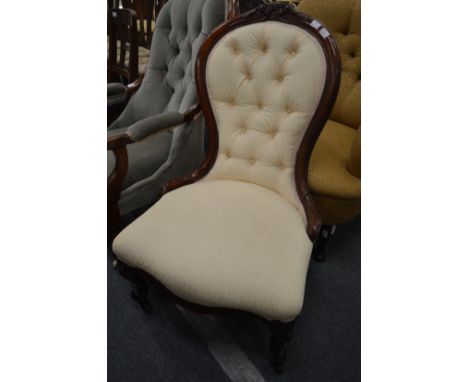 A Victorian button upholstered mahogany framed nursing chair.