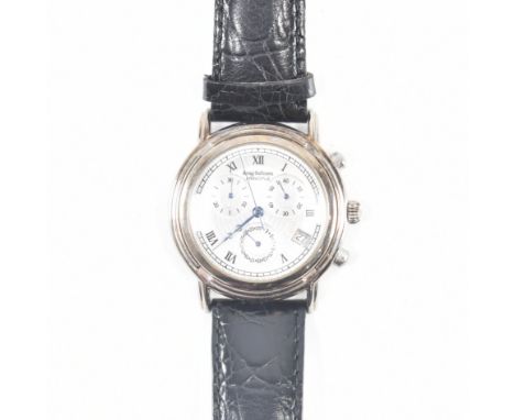 A Krug-Baumen Principle quartz wristwatch. The watch having a silvered engine turned dial inlaid with mother of pearl, three 