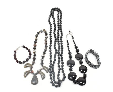 An assorted collection of vintage &amp; later stone bead jewellery. The lot to include; snowflake obsidian bracelet, multi st