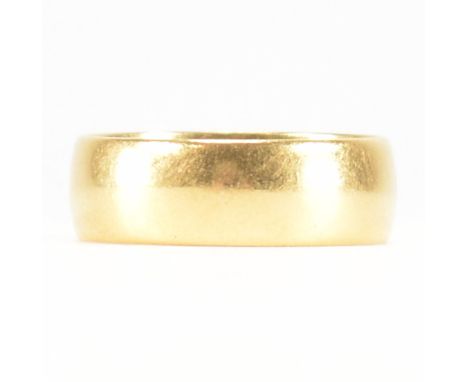 A hallmarked 22ct yellow gold band ring. The wedding band style ring of wide D form. Hallmarked for Birmingham 1965, makers m