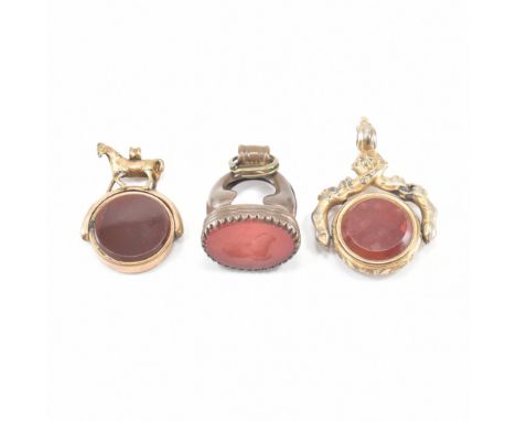 An assorted collection of Victorian stone set fob pendants. The first antique pendant set with a red stone intaglio depicting