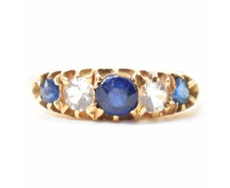 A hallmarked 18ct gold blue and white stone ring. The ring being set with three round cut blue stones and two round cut white