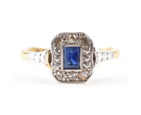 A 1920s 18ct yellow gold, platinum, sapphire &amp; diamond ring. The ring having a central rectangular cut sapphire in milleg