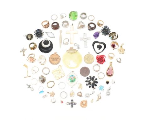 An assorted collection of costume jewellery rings &amp; necklace pendants. The lot to include; gold &amp; silver tone metal, 