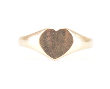 A hallmarked 9ct rose gold heart signet ring. The ring having an unengraved heart head to tapering shank. Possible resizing /