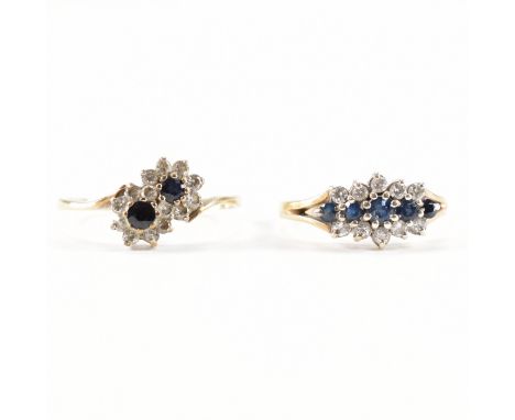 Two hallmarked 9ct yellow gold &amp; sapphire rings. The first ring in the form of two flower heads in a crossover setting ha