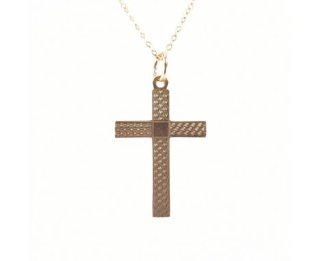 A hallmarked 9ct gold cross pendant necklace. The necklace having a engine turned front on a fine link chain. Pendant hallmar
