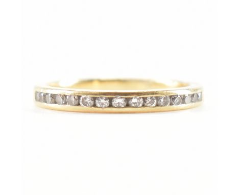 An 18ct gold and diamond half eternity ring. The ring being channel set with round cut diamonds on a plain band. Marked 18k. 