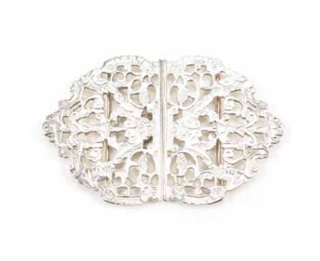 A vintage hallmarked silver belt buckle. The buckle having a moulded mirrored design to include scrolling foliate &amp; flora