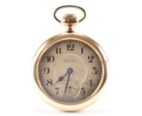 An early 20th Century Hamilton Watch Company lever set gold plated open face pocket watch. The face having arabic numerals to