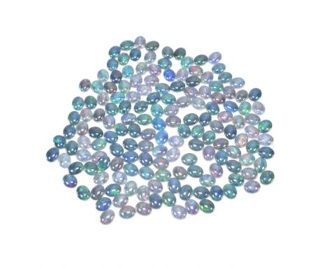 A jewellery making interest collection of opal triplet cabochons. The opal triplets with various play of colour, mainly blue 