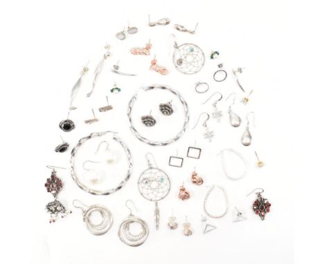 An assorted collection of silver earrings. The lot to include; drop earrings, studs, hoops, gold &amp; rose gold tones, plani