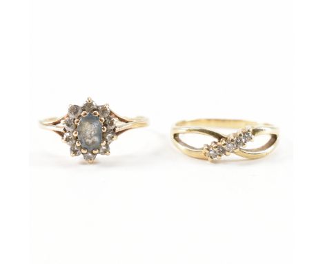 Two hallmarked 9ct yellow gold &amp; stone set ring. The first ring having five round cut diamonds in a split crossover setti