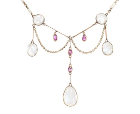 An Edwardian gold, moonstone &amp; ruby festoon collar necklace. The necklace strung with five moonstone cabochons with ruby 