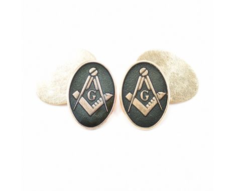 A pair of hallmarked 9ct yellow gold Masonic cuff links. Of chain style having oval heads decorated with Masonic emblem to a 