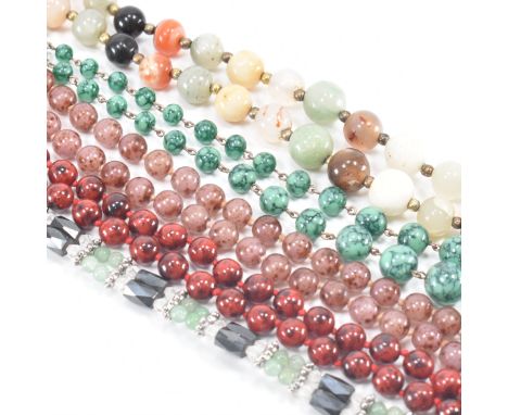 A collection of vintage beaded necklaces. The lot to include three vintage glass beaded necklaces, a polished stone beaded ne