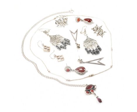 An assorted collection of silver earrings &amp; necklaces. The lot to include; screw back double rose earrings, orange stone 