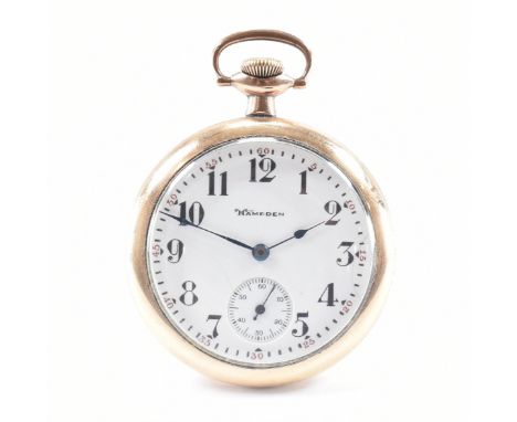 An early 20th Century Hampden gold plated open face pocket watch. The watch having a white enamelled face with arabic numeral