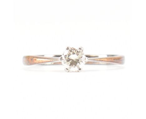 A vintage 18ct gold &amp; diamond solitaire ring. The engagement style ring having a round cut rotated six prong set diamond 