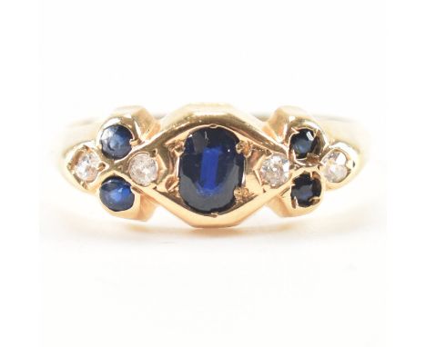 An early 20th Century antique hallmarked 18ct gold sapphire and diamond ring. The ring being set with an oval cut sapphire to