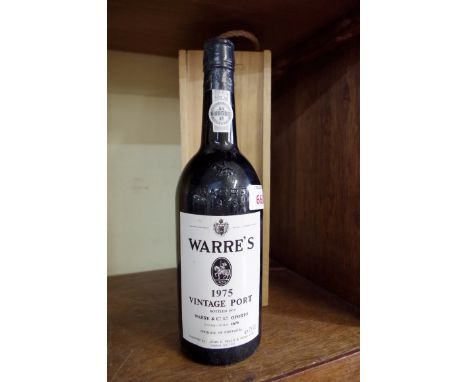 A bottle of Warre's 1975 vintage port, in original wooden box.