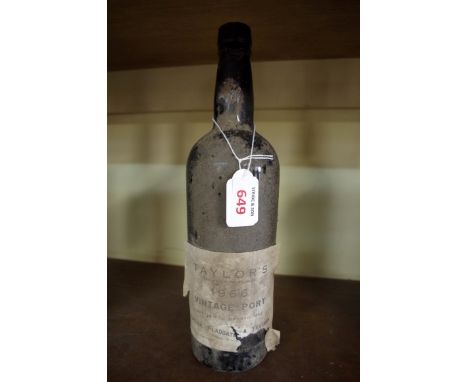 A bottle of Taylor's 1966 vintage port.  Condition Report: Provenance: From the estate of the late actor Geoff Hughes. The po