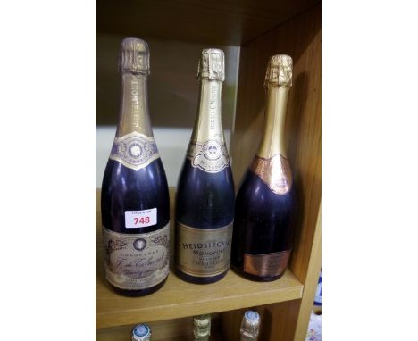 Three 75cl bottles of vintage champagne, comprising: Heidsieck Gold Top 2001; Sainsbury's 1995 Millenium Grand Cru; and J de 