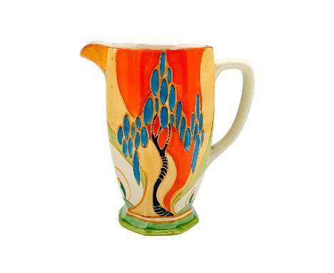 A hand painted Art Deco pitcher decorated with a colorful abstract floral and tree design. Clarice Cliff for Newport Pottery 