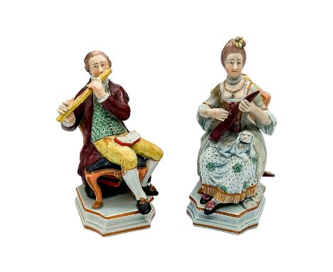 Hand painted pearlware seated figures in Rococo Era fashion. Depicts a man playing the flute, and a woman playing the lute. M