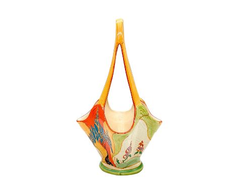 A hand painted Art Deco sculpted basket vase decorated in an abstract geometric trees and flowers in a colorful palette. Clar