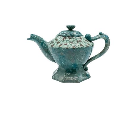 A beautiful blue and brown mosaic glaze teapot with geometric patterns. Doulton Lambeth impressed stamp on the base. Issued: 