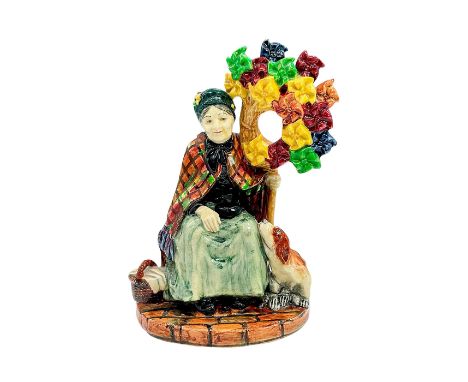 Very Rare Vintage FigureGlazed hand painted rare porcelain figurine of a street vendor with her dog. Yellow, green, orange an