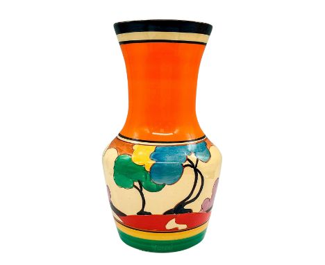 A stunning hand painted colorful Art Deco ceramic vase decorated in an abstract geometric trees and houses. Clarice Cliff for