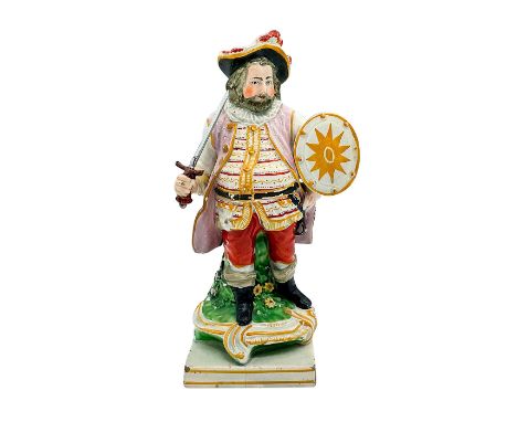 A hand painted ceramic figure of the Shakespearean character in a white and lilac coat holding a sword and shield. Wood and C