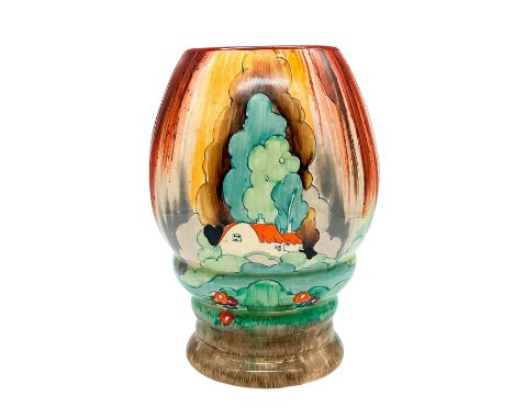 A hand painted Art Deco vase decorated in an abstract geometric landscape in a colorful palette. Clarice Cliff for Wilkinson 