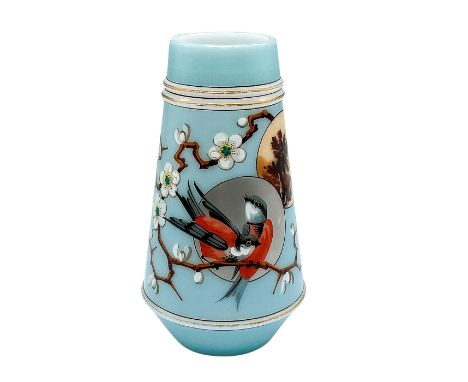 A beautiful hand decorated glass blown milk glass. Cerulean blue ground adorned with fired enamel birds perched on a white bl