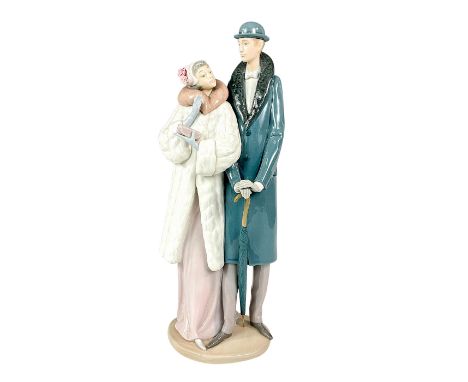 A couple dressed in early 20th century fashion standing side by side together. Lladro backstamp. This item has its original b