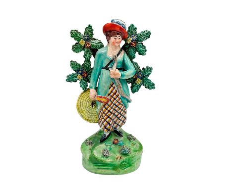 A hand painted pearlware bocage figure in the manner of John Walton of a woman holding bow and arrow. Walton impressed on the