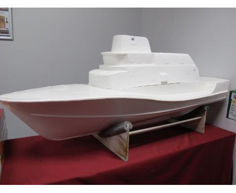 A Glass Fibre Bodyshell, in the form of a model cruiser boat, unpainted, ideal starter project, presented on a wooden plinth,