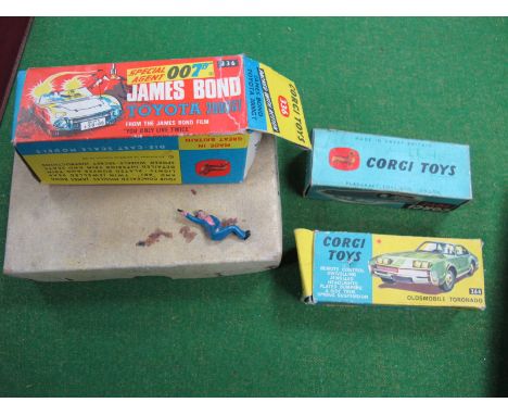 Four Empty Diecast Boxes, Corgi No. 336 James Bond Toyota (damaged), Corgi No. 264 Oldsmobile Tornado (damaged), Corgi No.210