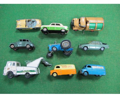 Six Mid XX Century Dinky Vehicles, one Spot-On and two Corgi including a Ford Supermajor Tractor, playworn.