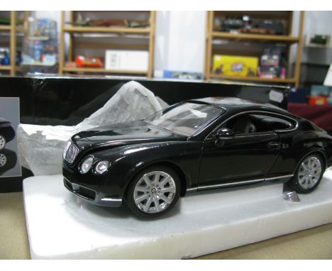 A Minichamps 1:18th Scale Diecast Model Bentley Continental GT, damage, missing parts, paint work issues noted, boxed.