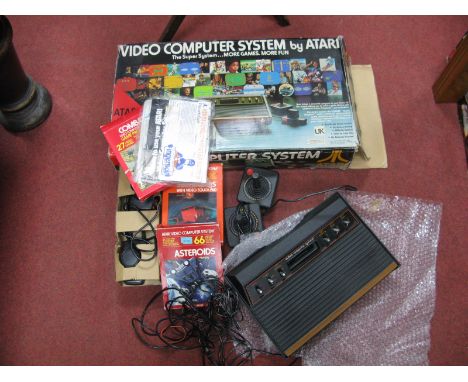 Atari CX2600 Video Computer System Gaming Console, (circa 1980) S/N S48255435, two joysticks, two paddles, games cartridges #