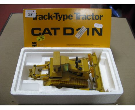 A Conrad 1:50th Scale Diecast Model Cat D11N Track Type Tractor, chip to paint work noted, boxed (damaged).