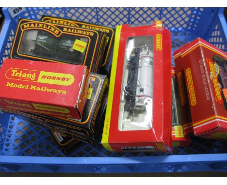 Twelve ''OO'' Gauge/4mm Items of Boxed Rolling Stock, by Hornby and Mainline. Tank wagons (3), SR, GW and LMS box vans, brake