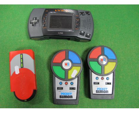 Atari Lynx Handheld Gaming Console, (missing battery cover), two MB Electronics Pocket Simon handheld games, electronic Pokem