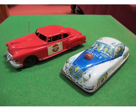 A 1950's Plastic Police Car, by Marx, friction drive, red plastic, 24cm long, plus a tinplate police car by PN of Western Ger