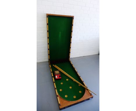 A Riley mahogany cased bagatelle board complete with cues and balls, 123cm long