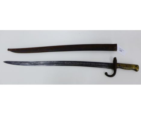 A 19th century French bayonet complete with scabbard, 72cm long 